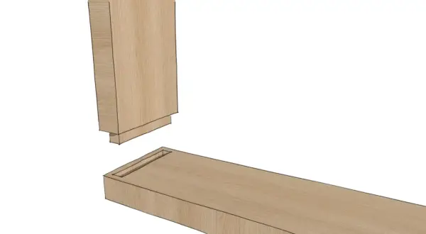 Assemblage de bois : un tenon mortaise en chêne, prêt à s'emboîter pour une structure solide.