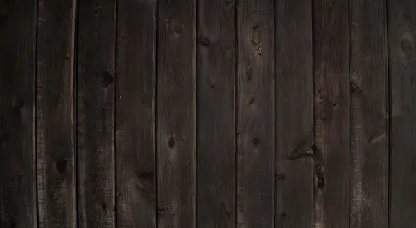 Planches de bois sombre, aspect vieilli, parfait pour noircir du bois et créer une ambiance rustique.