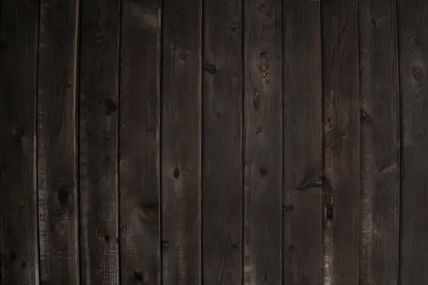 Planches de bois sombre, aspect vieilli, parfait pour noircir du bois et créer une ambiance rustique.